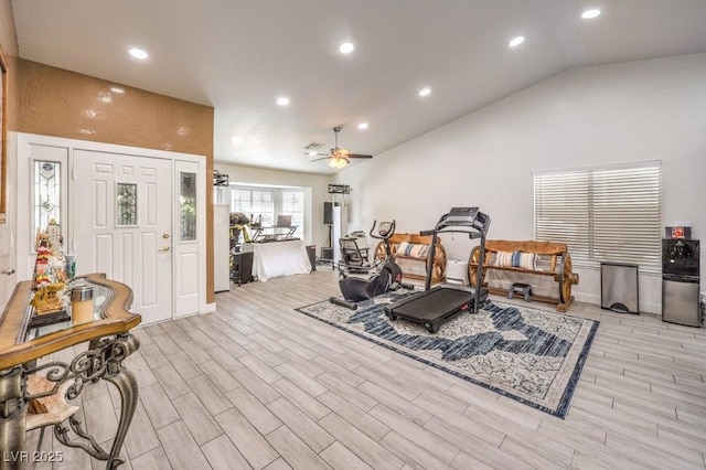 workout area featuring ceiling fan and lofted ceiling