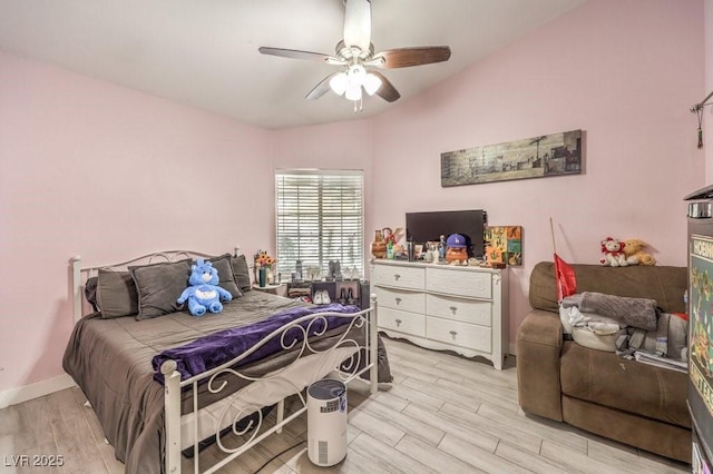 bedroom featuring light wood-type flooring and ceiling fan