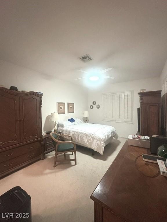 carpeted bedroom with ceiling fan