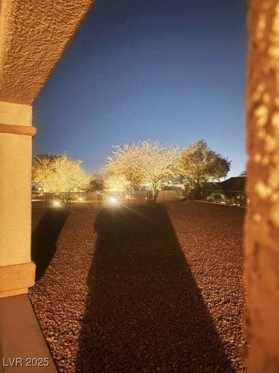 view of yard at dusk