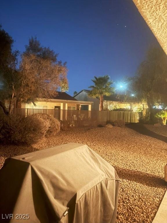 view of yard at night