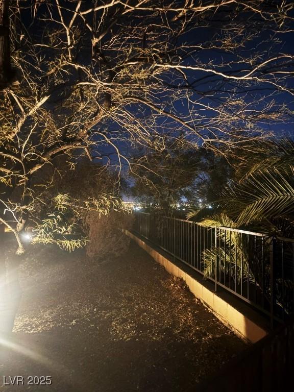 view of yard at twilight