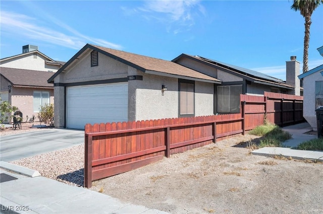 view of side of home with a garage