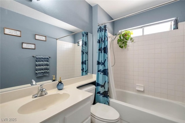 full bathroom featuring toilet, vanity, and shower / bathtub combination with curtain