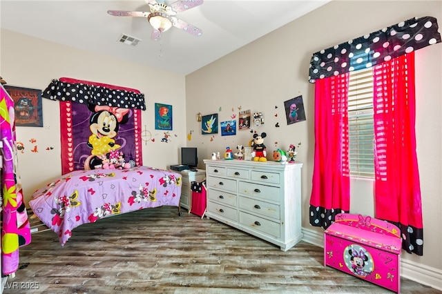 bedroom featuring dark hardwood / wood-style flooring and ceiling fan