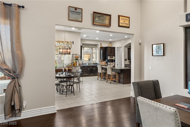 dining space featuring a chandelier and light hardwood / wood-style floors