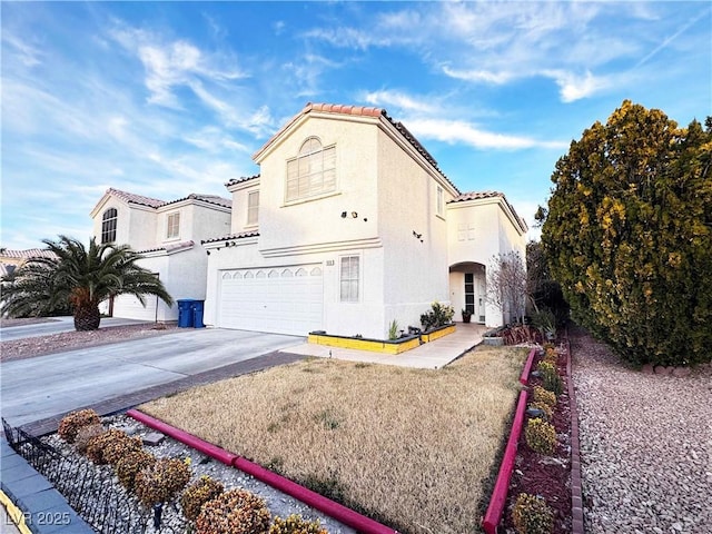 mediterranean / spanish-style home featuring a garage