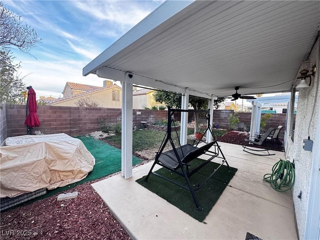 view of patio / terrace featuring ceiling fan