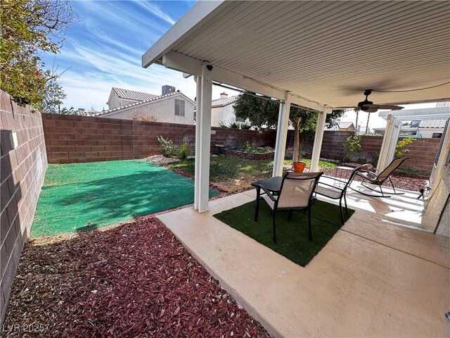 view of patio / terrace featuring ceiling fan