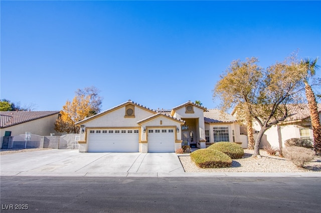 mediterranean / spanish-style home featuring a garage