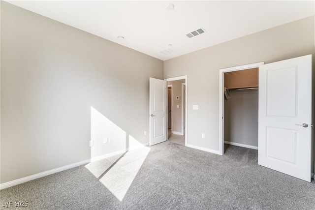 unfurnished bedroom with visible vents, light carpet, and baseboards