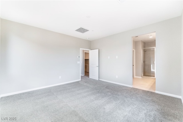 unfurnished bedroom featuring visible vents, baseboards, and carpet