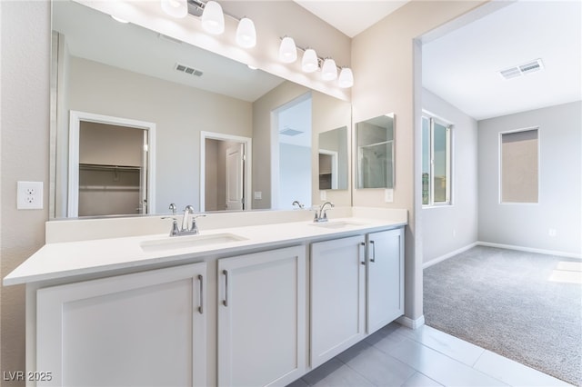 full bathroom featuring a sink, visible vents, and double vanity