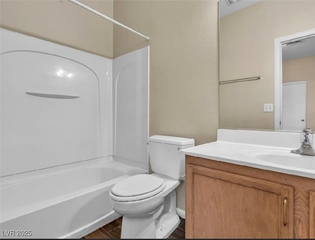 full bathroom featuring toilet, shower / bath combination, wood finished floors, visible vents, and vanity