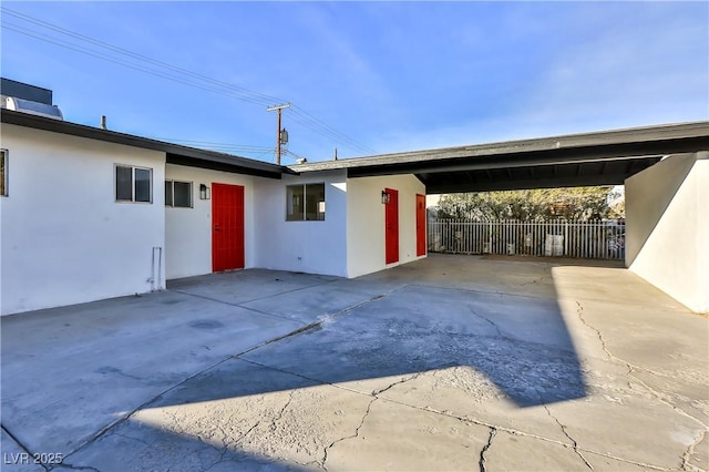 exterior space with a carport