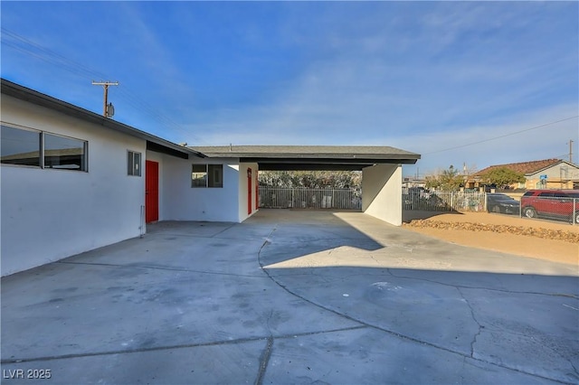 view of patio / terrace featuring a carport