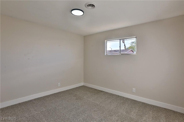 spare room featuring carpet floors