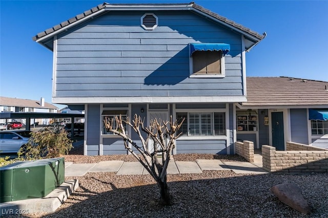 exterior space with a tile roof