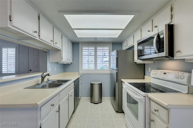 5340 Silvermist Ct Unit 103, Las Vegas, NV 89122 - kitchen featuring stainless steel appliances, a sink, light countertops, light tile patterned floors, and baseboards