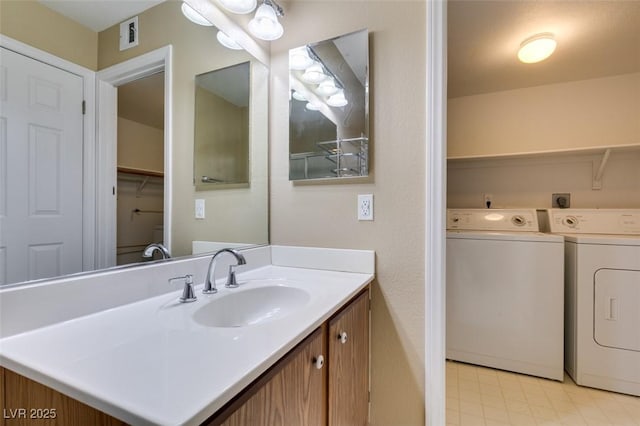 5340 Silvermist Ct Unit 103, Las Vegas, NV 89122 - bathroom featuring washing machine and clothes dryer and vanity
