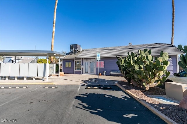 5340 Silvermist Ct Unit 103, Las Vegas, NV 89122 - view of property featuring central air condition unit and uncovered parking