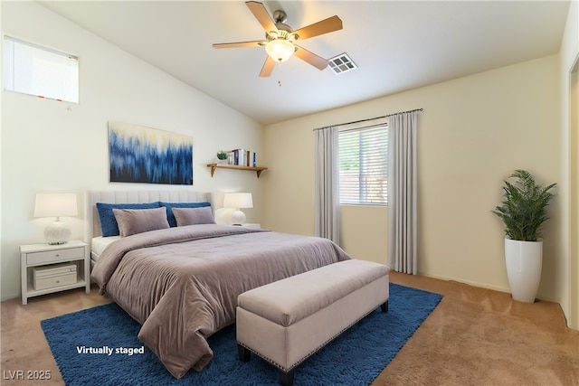 carpeted bedroom with ceiling fan and lofted ceiling