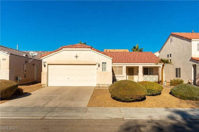 mediterranean / spanish-style house with a garage