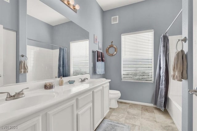 full bathroom with shower / bath combo with shower curtain, toilet, and vanity