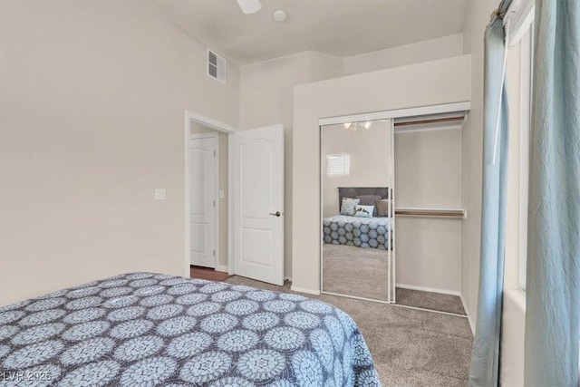 carpeted bedroom featuring a closet