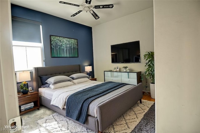 bedroom with ceiling fan and hardwood / wood-style floors