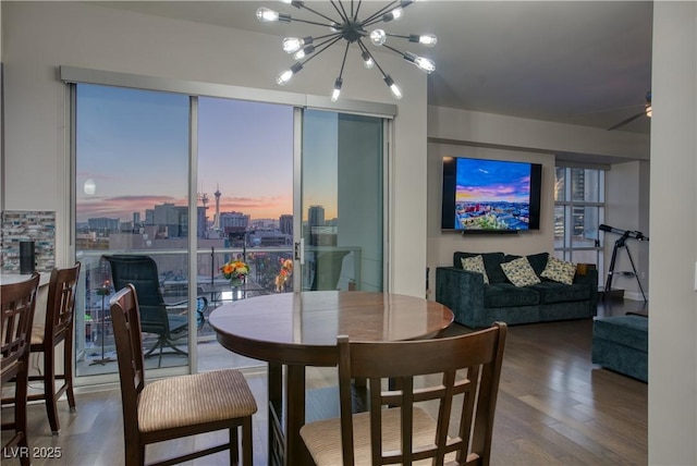 dining space featuring a notable chandelier and hardwood / wood-style floors