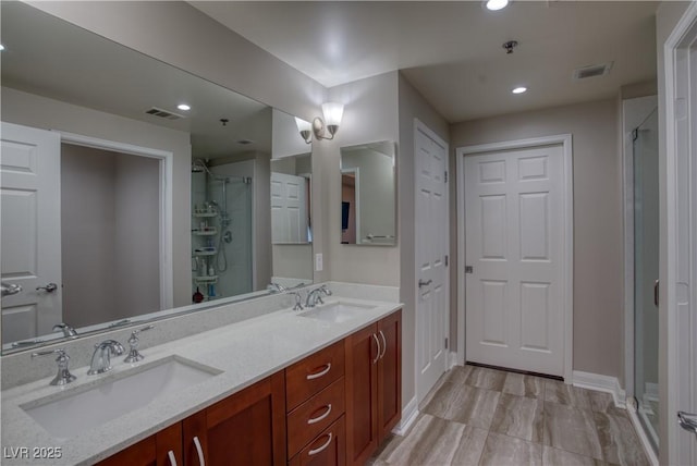 bathroom featuring walk in shower and vanity