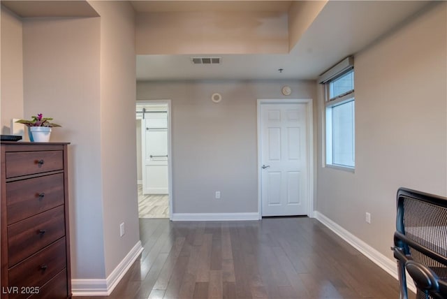 home office with dark wood-type flooring