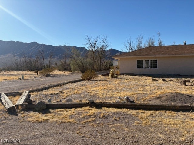 exterior space featuring a mountain view