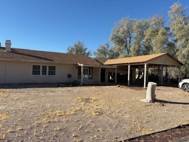 ranch-style house featuring a carport