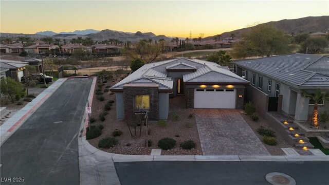 view of front of home featuring a garage and a mountain view