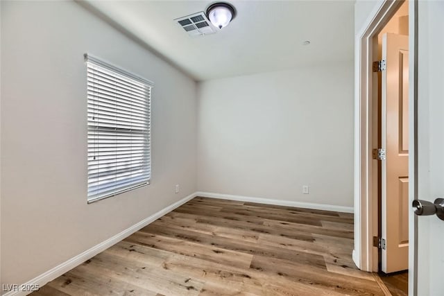 empty room with wood-type flooring