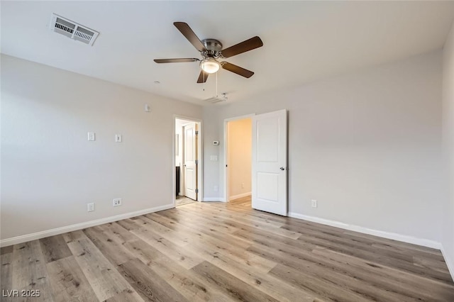 spare room with light wood-type flooring and ceiling fan