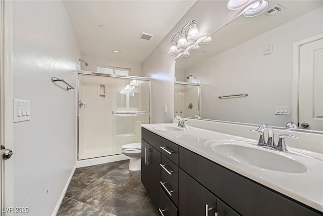 bathroom featuring toilet, an enclosed shower, and vanity