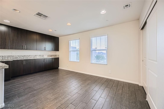 kitchen featuring dark brown cabinets