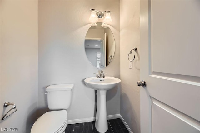 bathroom with toilet and sink