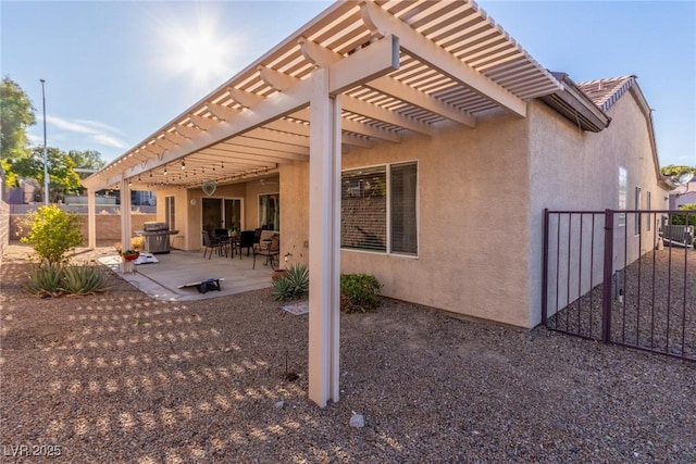 back of house with a patio and a pergola