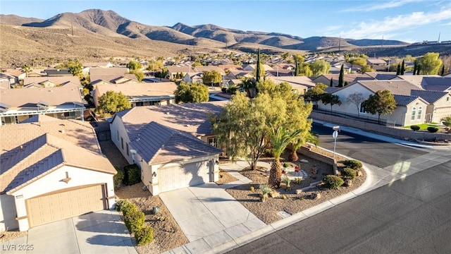 drone / aerial view featuring a mountain view