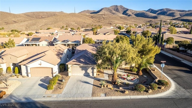 birds eye view of property with a mountain view