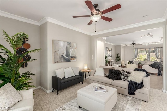 living room featuring ceiling fan, light colored carpet, and crown molding