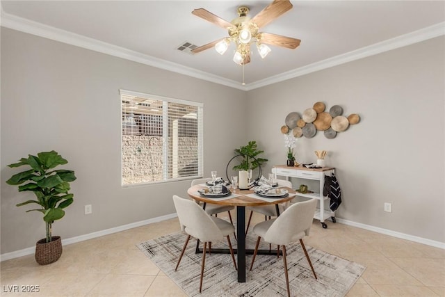 dining room featuring ceiling fan, light tile patterned floors, and ornamental molding