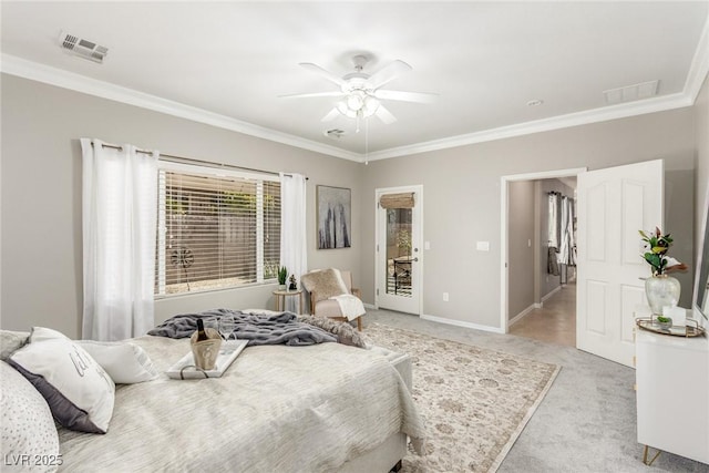 carpeted bedroom with ceiling fan and ornamental molding