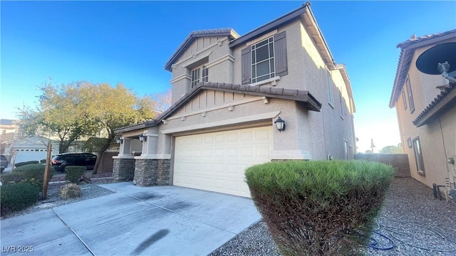 view of side of property featuring a garage