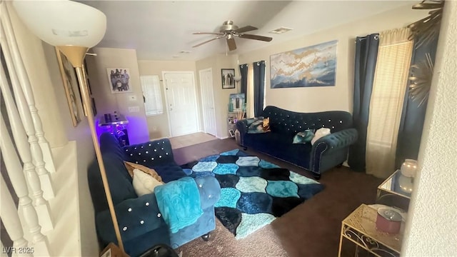 living room featuring ceiling fan and carpet flooring