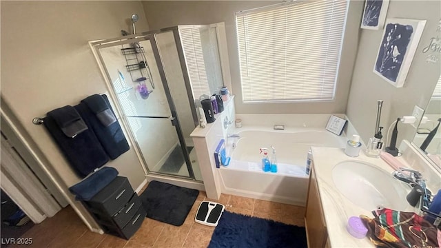 bathroom featuring tile patterned floors, vanity, and separate shower and tub